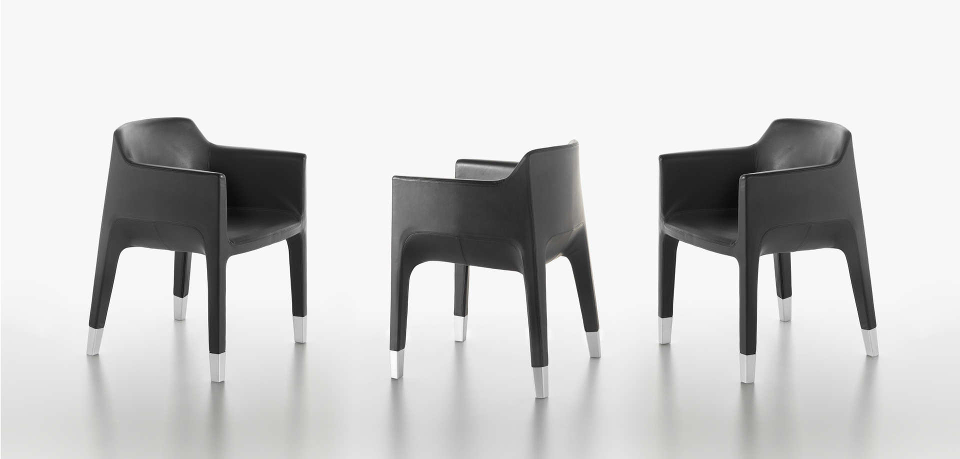 Plank - MON AMI armchair with steel frame, matt chrome feet, coverings in leather or textile.