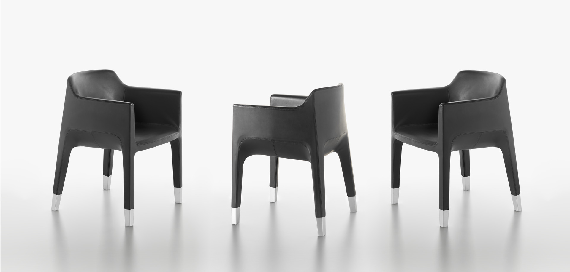 Plank - MON AMI armchair with steel frame, matt chrome feet, coverings in leather or textile.