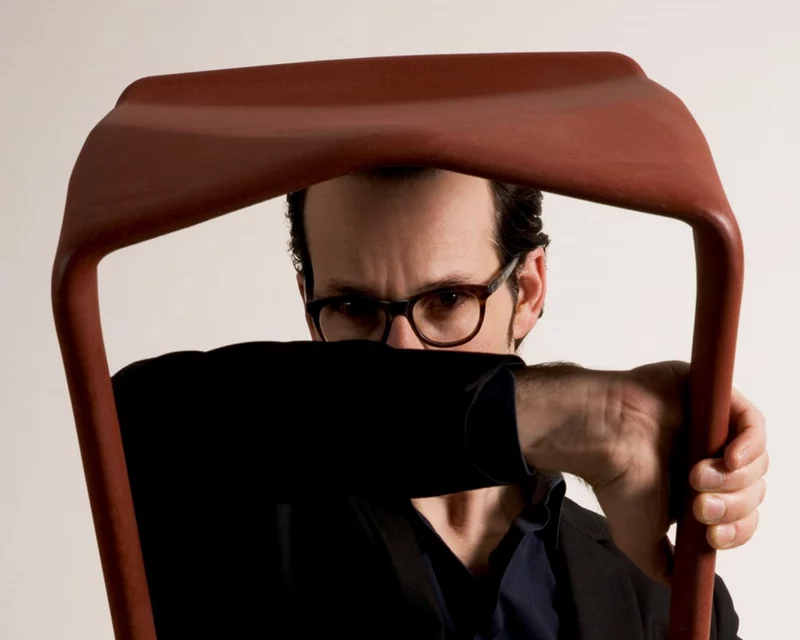 Konstantin Grcic looking through the frame of a MIURA stool